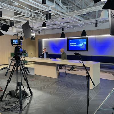 Business leaders participate in live event broadcast from office